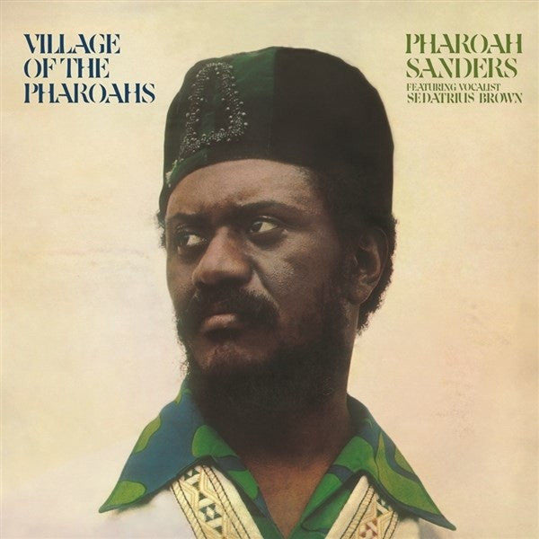 Album cover featuring a man wearing a green hat and shirt with text 'Village of the Pharaohs' and 'Pharoah Sanders'.