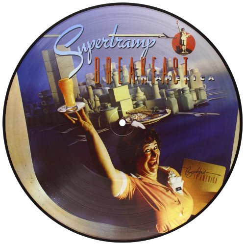 A picture disc vinyl LP of Supertramp's album Breakfast In America, featuring a woman holding a beer in front of a cityscape