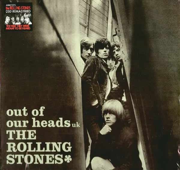 Album cover of 'The Rolling Stones' with band members and text 'out of our heads uk'.