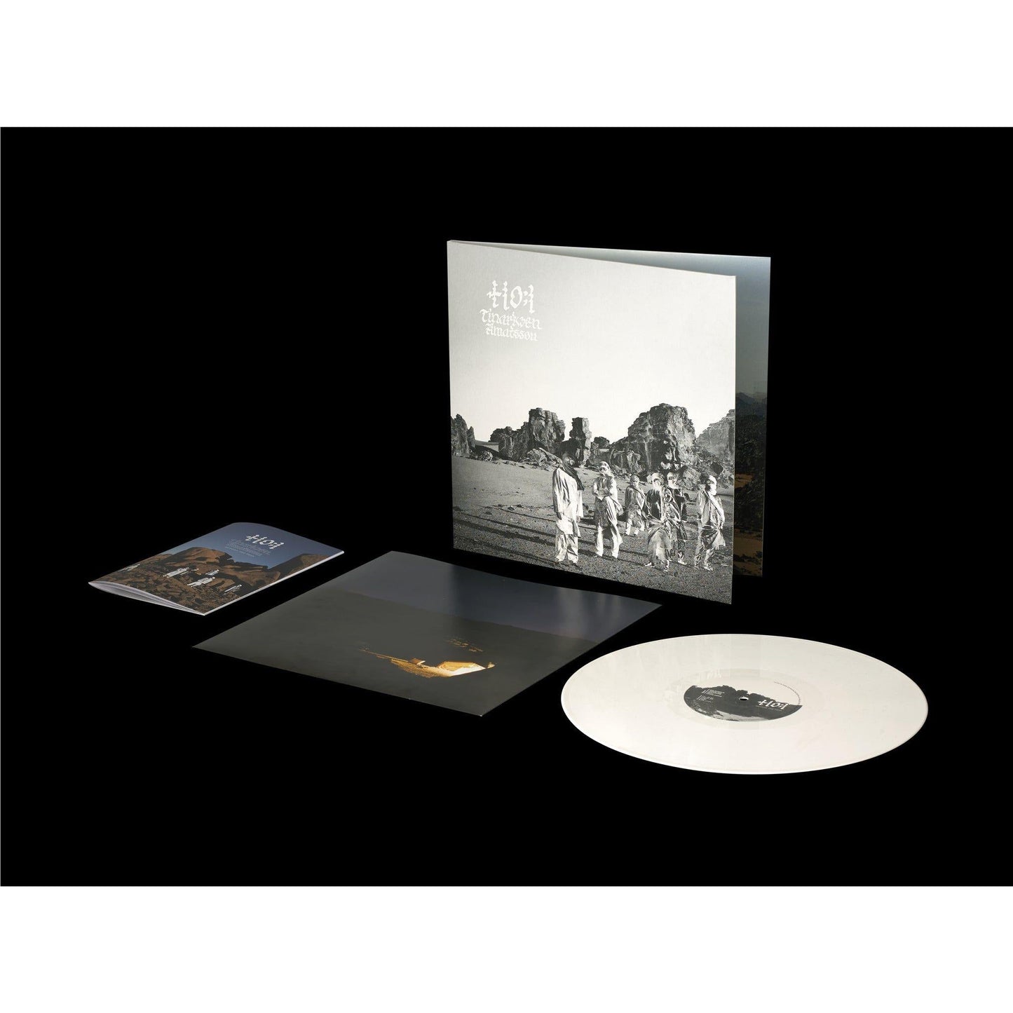 A white vinyl LP of Tinariwen's album 'Amatssou' with a black and white cover featuring the band and desert scenery.