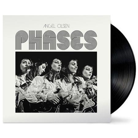 A vinyl LP record of Angel Olsen's album 'Phases' with a black label featuring a monochrome photograph of the artist.
