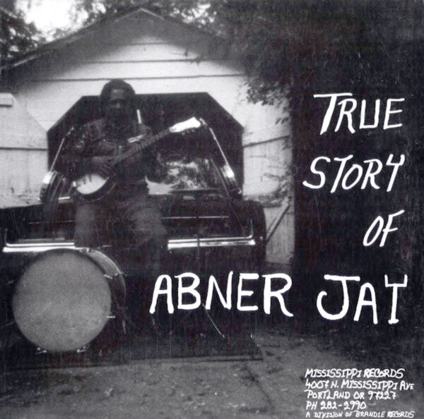 The image shows the cover of the vinyl LP titled 'True Story Of Abner Jay' featuring a black and white photo of Jay holding a guitar in front of a car.