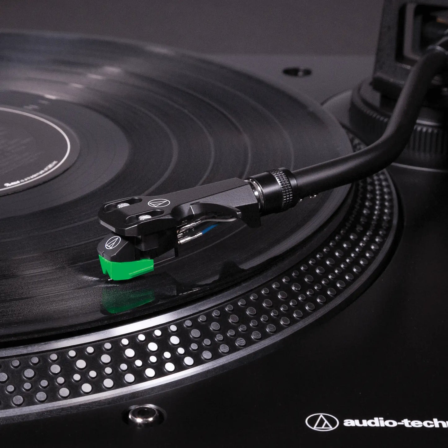 close up of Audio-Technica AT-LP120XUSB record player cartridge and tonearm