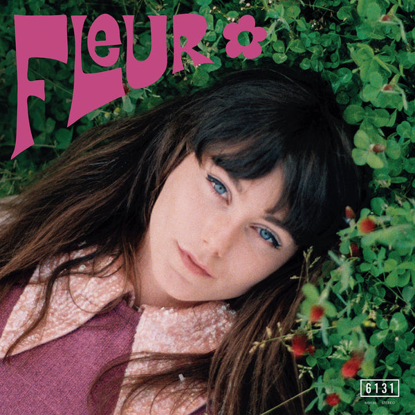 Album cover of Fleur - Self-Titled featuring Fleur with long hair and blue eyes lying down, surrounded by greenery with the band's name 'Fleur' in pink text above.