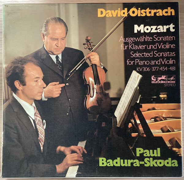 Cover of the vinyl box set 'Mozart - Sonaten für Klavier und Violine' featuring two men, one playing the piano and the other holding a violin, with the artists' names and the title of the piece written on it.