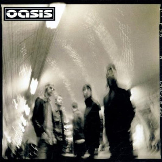 Oasis - Heathen Chemistry album cover with a blurred photo of the band members in a subway station