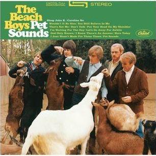 The cover of 'Pet Sounds' by The Beach Boys depicts the band members with farm animals. From left to right, the band members are seen interacting with the animals.