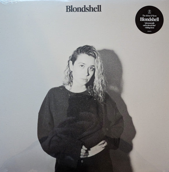 A vinyl LP record of Blondshell with a black and white photograph of blondshell on the cover. The album title and artist name are visible on the label.