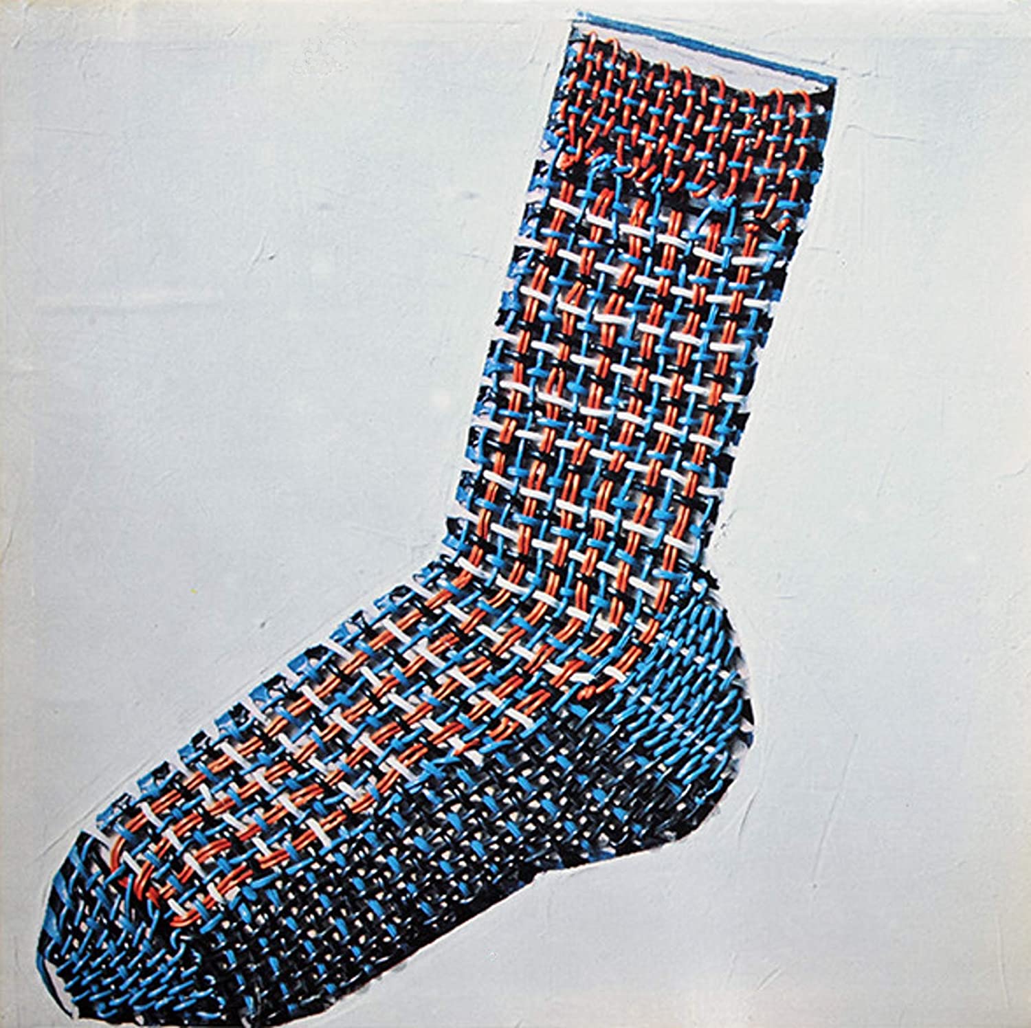 Album cover artwork by Ray Smith, featuring the first of his three ‘paint sock’ designs used on Henry Cow releases