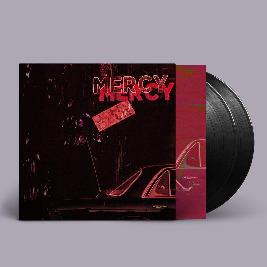 John Cale - Mercy album vinyl LP with a dark cover featuring the title 'MERCY' in red text over a abstract image of a car 