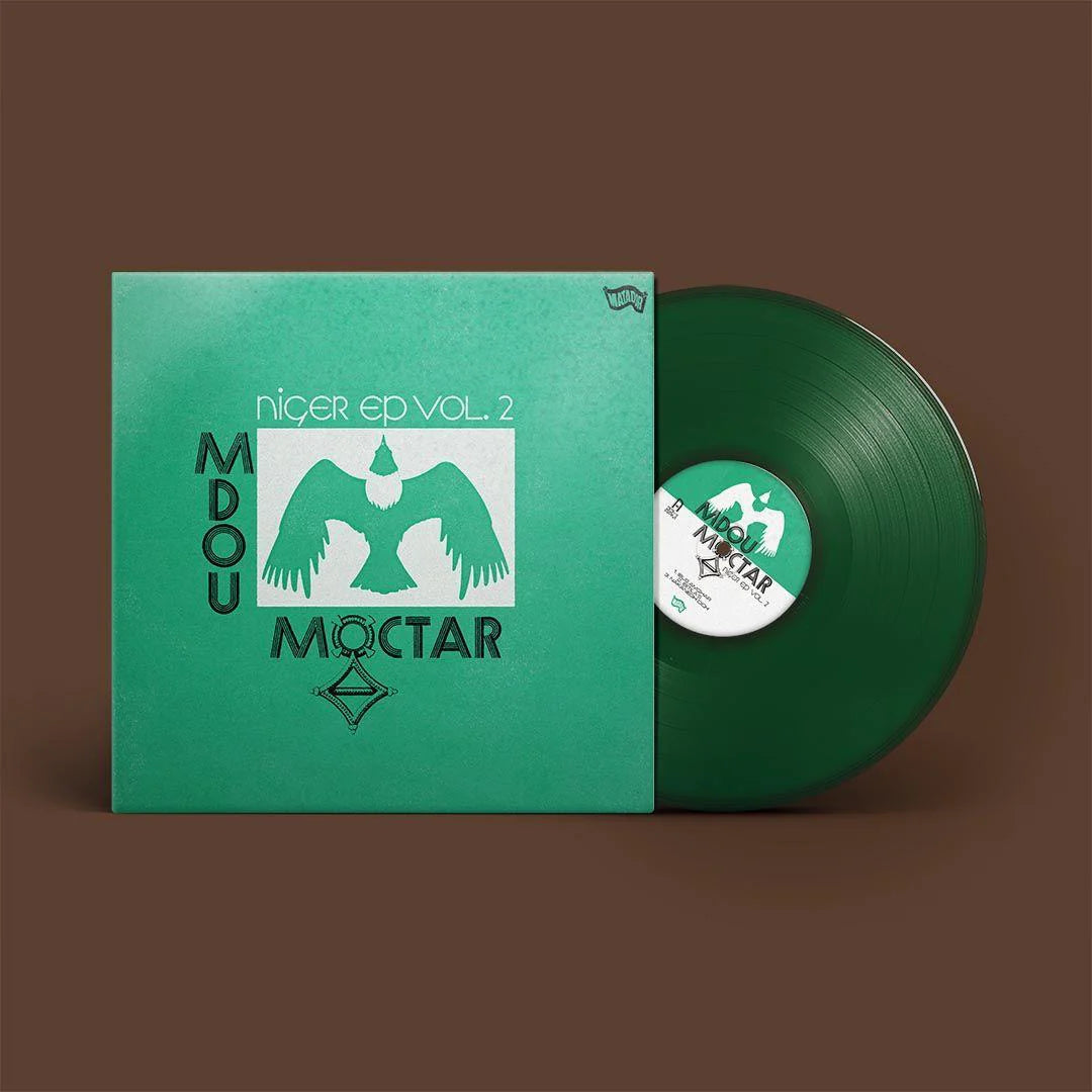 A vinyl record titled 'Mdou Moctar - Niger EP Vol. 2' with a green cover and a green record showing