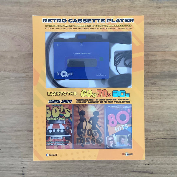 Retro cassette player packaging with images of a cassette and text on a wooden surface