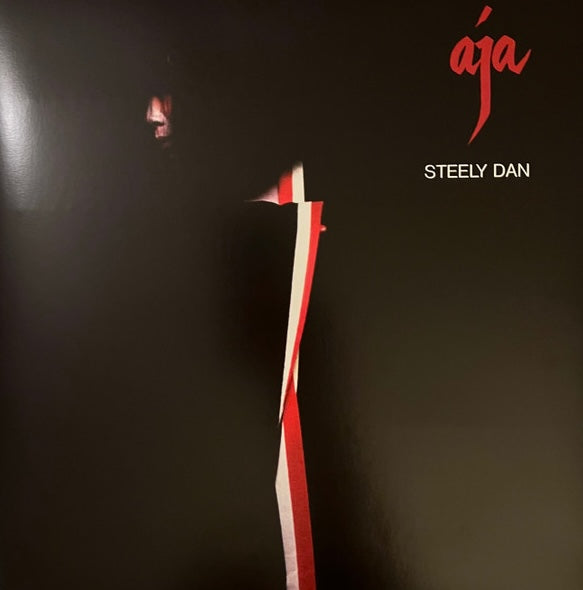 Aja gatefold vinyl LP by Steely Dan, jazz-rock collectible vinyl, abstract red, white and black cover art