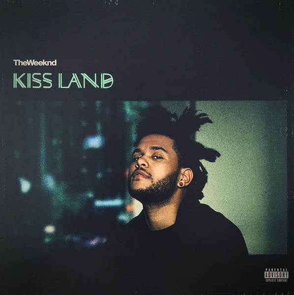 The Weeknd - Kiss Land vinyl record cover featuring a photograph of The Weeknd with a dark tone and text on the upper part of the cover.