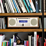Tivoli Audio Music System Plus, walnut beige finish on the shelf