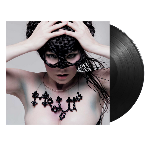 A vinyl LP cover featuring Björk with a mask and black attire, against a white background.