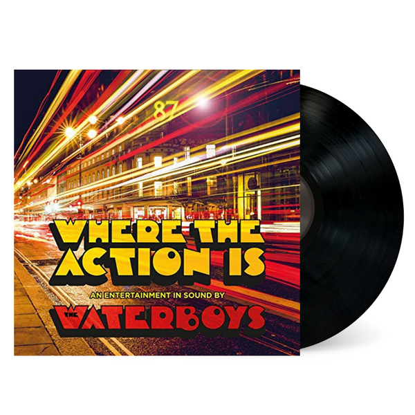 Vinyl LP of The Waterboys' album 'Where The Action Is' with a red and yellow cover featuring a blurred image of a cityscape at night.