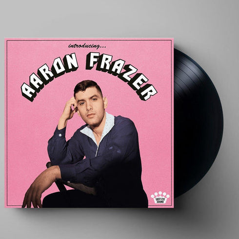 A vinyl LP record of Aaron Frazer's album 'Introducing...' featuring a photo of the artist on the front cover.