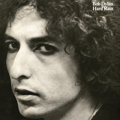 Black and white album cover of Bob Dylan with the title 'Hard Rain' printed at the top.